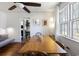 Inviting dining room featuring hardwood floors, a modern ceiling fan, and a view of the living room at 632 Magnolia Dr., Georgetown, SC 29440