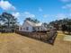 Quaint white house with a metal roof, picket fence, and well-maintained yard at 632 Magnolia Dr., Georgetown, SC 29440