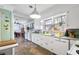 Bright kitchen featuring white cabinetry, modern appliances, tile floor, and hanging pendant lighting at 632 Magnolia Dr., Georgetown, SC 29440