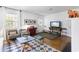 Bright living room featuring hardwood floors, a decorative fireplace, and comfortable seating at 632 Magnolia Dr., Georgetown, SC 29440