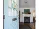 View from the entry featuring a fireplace, a decorative rug, and hardwood floors at 632 Magnolia Dr., Georgetown, SC 29440