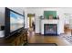 Cozy living room with a fireplace, hardwood floors, and a view into other parts of the home at 632 Magnolia Dr., Georgetown, SC 29440