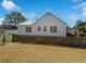 Side exterior featuring a picket fence and view of the backyard and the home's windows at 632 Magnolia Dr., Georgetown, SC 29440