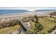 Stunning aerial view showcases the beach access and playground amenities with lush landscaping at 6804 N Ocean Blvd. # 631, Myrtle Beach, SC 29572