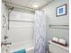 Bathroom featuring white tiled walls, a shower/tub combination and modern fixtures at 6804 N Ocean Blvd. # 631, Myrtle Beach, SC 29572
