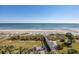 Expansive aerial beach view with playground, walkway, and the ocean in the background at 6804 N Ocean Blvd. # 631, Myrtle Beach, SC 29572