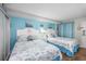 Charming bedroom with two beds, seashell headboards, and coastal decor at 6804 N Ocean Blvd. # 631, Myrtle Beach, SC 29572