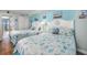 Bright bedroom featuring two beds, coastal decor, and easy access to the balcony at 6804 N Ocean Blvd. # 631, Myrtle Beach, SC 29572