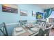 Bright dining area featuring a dining table set for four, with a TV and balcony in view at 6804 N Ocean Blvd. # 631, Myrtle Beach, SC 29572