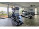 Well-equipped gym area with an elliptical, treadmill, and scenic ocean views from large windows at 6804 N Ocean Blvd. # 631, Myrtle Beach, SC 29572