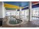 Charming indoor pool area with inviting hot tub surrounded by tropical colors and decor at 6804 N Ocean Blvd. # 631, Myrtle Beach, SC 29572