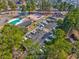 Aerial view showcasing community amenities including the pool, tennis courts, and boat storage at 6839 Blue Heron Blvd. # 105, Myrtle Beach, SC 29588