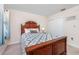 Comfortable bedroom with wood furnishings, patterned quilt, and natural light at 6839 Blue Heron Blvd. # 105, Myrtle Beach, SC 29588