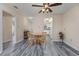 Bright dining area featuring a round wood table and matching chairs, plus modern flooring at 6839 Blue Heron Blvd. # 105, Myrtle Beach, SC 29588