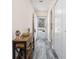 Hallway with wood-look floors, stylish accents, and easy access to various rooms at 6839 Blue Heron Blvd. # 105, Myrtle Beach, SC 29588