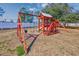 Community playground with swings and a play structure for enjoyment at 6839 Blue Heron Blvd. # 105, Myrtle Beach, SC 29588