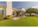 Expansive backyard with a screened porch, patio, and well-maintained lawn at 724 Alexis Dr., Longs, SC 29568