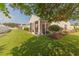 Well-maintained backyard featuring a screened porch, lush lawn and mature landscaping at 724 Alexis Dr., Longs, SC 29568