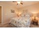 A lovely bedroom showcases a comfortable bed with floral bedding and soft lighting, creating a calm atmosphere at 724 Alexis Dr., Longs, SC 29568