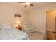 Comfortable bedroom with a cozy bed, recliner, and neutral decor at 724 Alexis Dr., Longs, SC 29568
