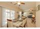 This dining room features a modern table, sliding glass doors, and seamlessly connects to a cozy living space at 724 Alexis Dr., Longs, SC 29568