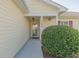 Charming front entrance featuring a covered porch, well-maintained landscaping, and house number at 724 Alexis Dr., Longs, SC 29568