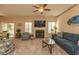 Cozy living room featuring a fireplace, plush seating, and sliding glass doors to the outdoors at 724 Alexis Dr., Longs, SC 29568