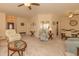 Bright and airy living area flows into the dining room with neutral tones and lots of natural light at 724 Alexis Dr., Longs, SC 29568