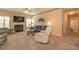 Inviting living room with a fireplace, plush seating, and a ceiling fan at 724 Alexis Dr., Longs, SC 29568