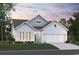 Charming one-story home with white siding, a two-car garage, and a well-manicured front lawn at 791 Wailea Circle, Little River, SC 29566