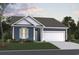 Charming single-story home with a two-car garage, landscaped yard, and inviting curb appeal at 8655 Farrier Dr., Myrtle Beach, SC 29588