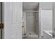 Bright bathroom featuring a tiled shower with neutral colored tile and a shower curtain for added privacy at 912 Tiffany Ln., North Myrtle Beach, SC 29582