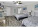 Spacious bedroom with two queen beds, gray wood flooring, and coastal decor at 912 Tiffany Ln., North Myrtle Beach, SC 29582