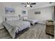 Bedroom featuring two beds, wood-look flooring, and coastal-themed decor at 912 Tiffany Ln., North Myrtle Beach, SC 29582