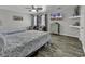Bedroom showcasing two beds, wood-look flooring, and a mounted TV at 912 Tiffany Ln., North Myrtle Beach, SC 29582