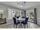 Bright dining room with bay window, french doors, and seating for four at 912 Tiffany Ln., North Myrtle Beach, SC 29582