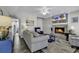 Inviting living room with a fireplace, ceiling fan, coastal decor, and comfortable seating at 912 Tiffany Ln., North Myrtle Beach, SC 29582