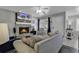 Cozy living room with stone fireplace, TV, plush sofa, and stylish decor at 912 Tiffany Ln., North Myrtle Beach, SC 29582