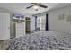 Comfortable bedroom with a ceiling fan, TV, closet, and lots of natural light at 912 Tiffany Ln., North Myrtle Beach, SC 29582