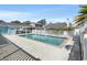Community swimming pool featuring a white picket fence, lounge chairs and clear blue water at 912 Tiffany Ln., North Myrtle Beach, SC 29582