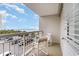 Relax on this condo's balcony featuring beautiful ocean views and comfortable outdoor seating at 9820 Queensway Blvd. # 301, Myrtle Beach, SC 29572