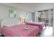 Bedroom featuring two beds and sliding glass door with curtains to balcony at 9820 Queensway Blvd. # 301, Myrtle Beach, SC 29572