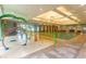 Indoor pool featuring a splash area, swimming pool, and ample seating for relaxation at 9820 Queensway Blvd. # 301, Myrtle Beach, SC 29572