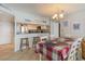 Open kitchen with stainless steel appliances is featured alongside a dining area at 9820 Queensway Blvd. # 301, Myrtle Beach, SC 29572