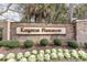 Kingston Plantation signage among lush landscaping and mature trees, creating an inviting entrance at 9820 Queensway Blvd. # 301, Myrtle Beach, SC 29572