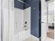 Charming bathroom features a shower and bathtub combination with stylish blue walls at 1017 World Tour Blvd. # 206, Myrtle Beach, SC 29579