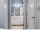 Bathroom features a single sink vanity, granite countertops, and modern lighting fixtures at 1017 World Tour Blvd. # 206, Myrtle Beach, SC 29579