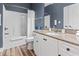 Bathroom with white cabinets, granite countertop, tub with shower, toilet, and wood-look flooring at 1017 World Tour Blvd. # 206, Myrtle Beach, SC 29579