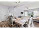 Dining area with a large wooden table, chairs and a view into the living room at 1017 World Tour Blvd. # 206, Myrtle Beach, SC 29579