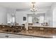 Open concept view from kitchen features granite countertops and an adjoining living area at 1017 World Tour Blvd. # 206, Myrtle Beach, SC 29579